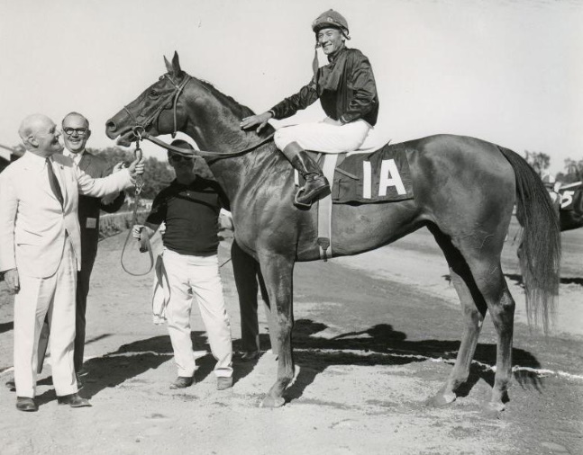 Buckpasser (Braulio Baeza up) in the winner's circle for the 1966 Travers Stakes at Saratoga (NYRA/Museum Collection)