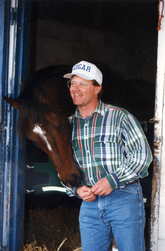 Cigar with trainer Bill Mott at Payson Park, February 1996 (Barbara D. Livingston/Museum Collection)