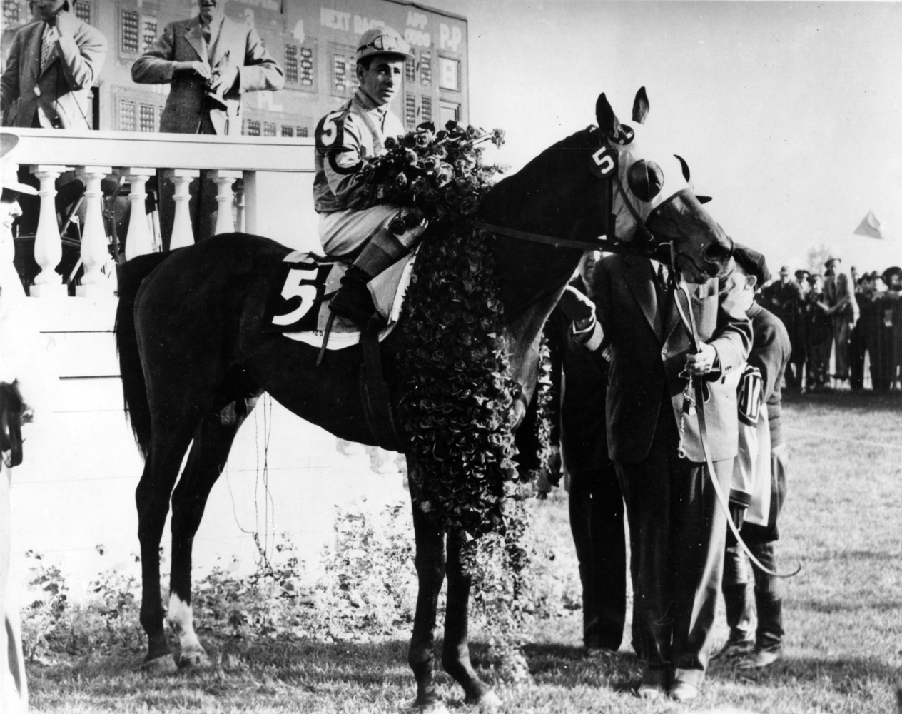 Count Fleet and Johnny Longden in the winner's circle for the 1943 Kentucky Derby (Churchill Downs Inc./Kinetic Corp. /Museum Collection)