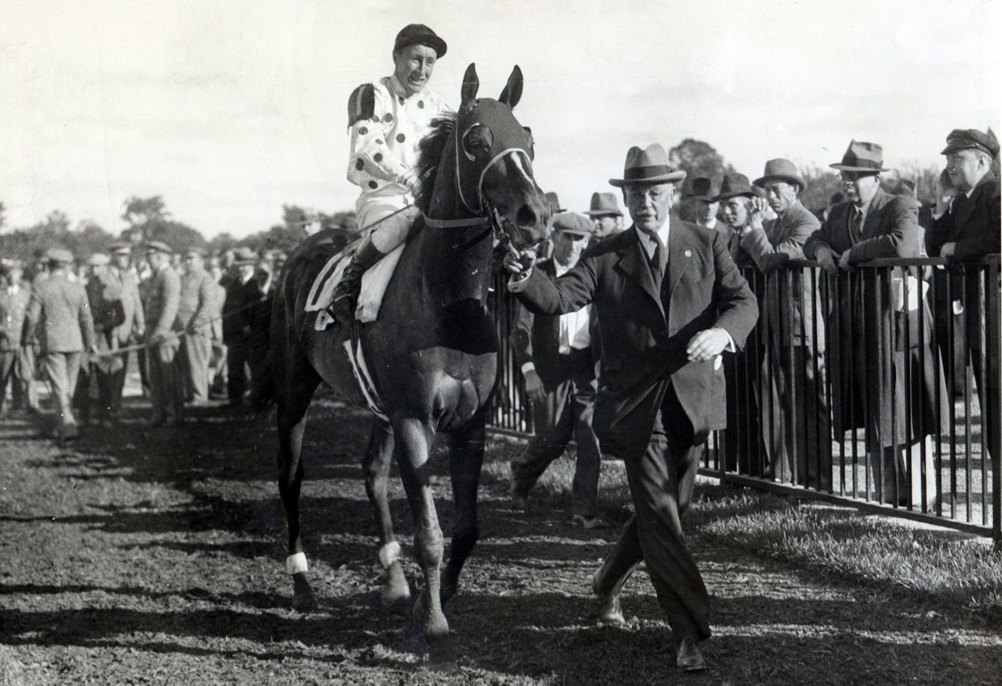 Granville (James Stout up) being led in by owner William Woodward, Jr. after winning the 1936 Lawrence Realization at Belmont Park, his final race (Museum Collection)