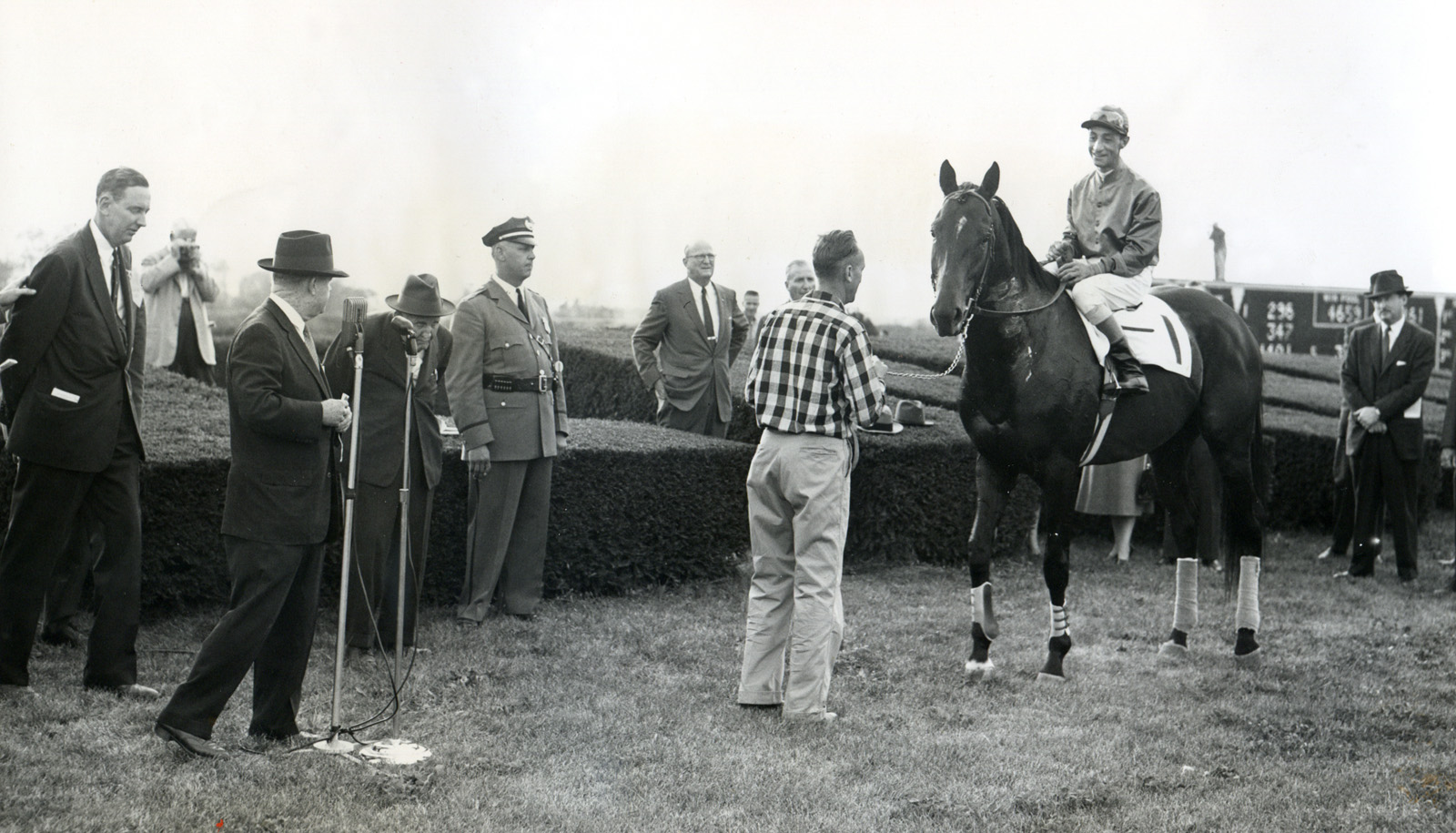 Nashua's farewell appearance at Keeneland with Eddie Arcaro up and trainer "Sunny Jim" Fitzsimmons in attendance, October 1956 (Museum Collection)