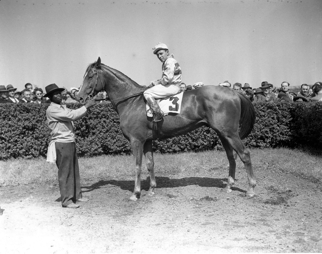 Stymie (John Adams up) in the winner's circle for the 1945 Rancocas Handicap at Jamaica, May 1945 (Keeneland Library Morgan Collection/Museum Collection)