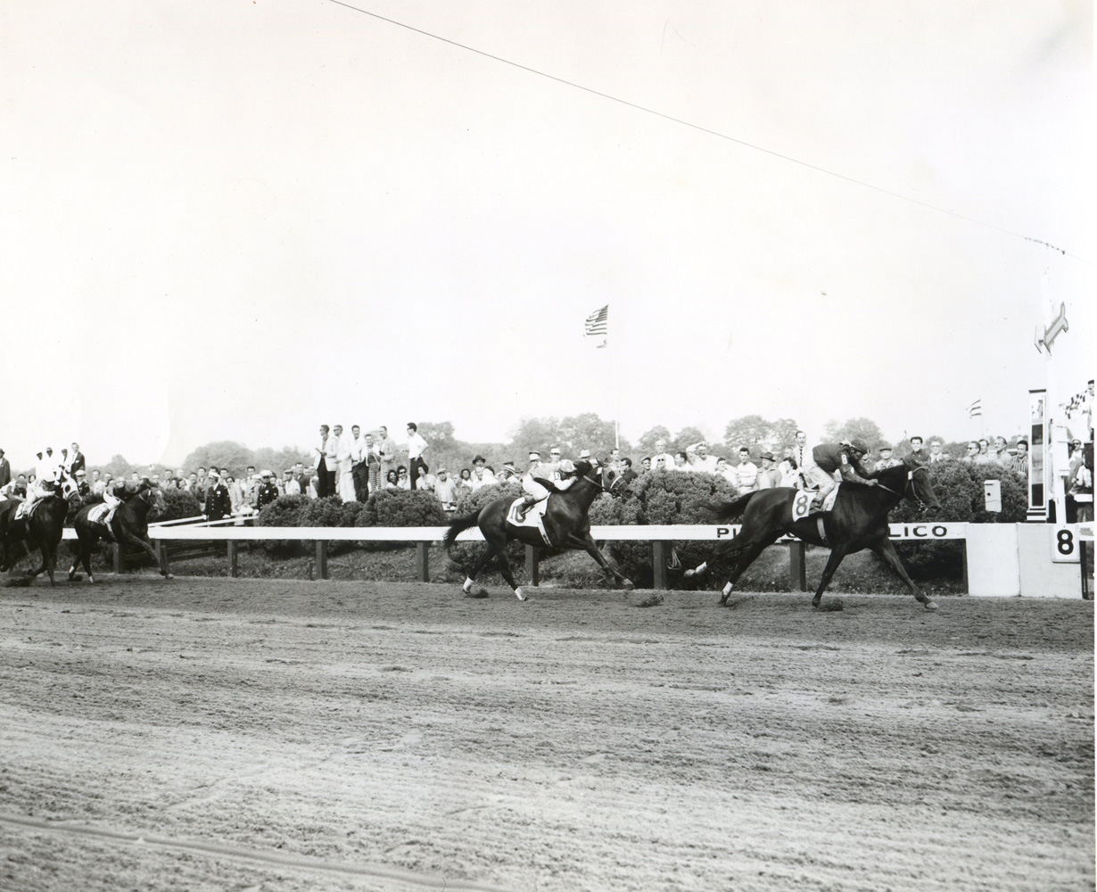 Tim Tam (Ismael Valenzuela up) winning the 1958 Preakness at Pimlico (Pimlico Photo/Jerry Frutkoff /Museum Collection)