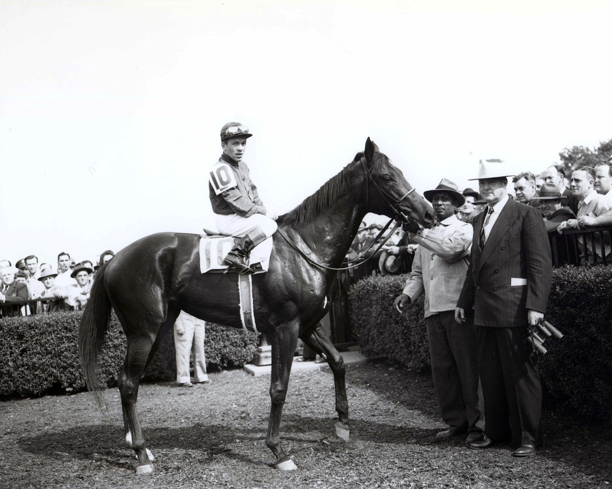 Twilight Tear (Conn McCreary up) with trainer Ben Jones in the winner's circle for the 1944 Acorn at Belmont Park (Keeneland Library Morgan Collection/Museum Collection)