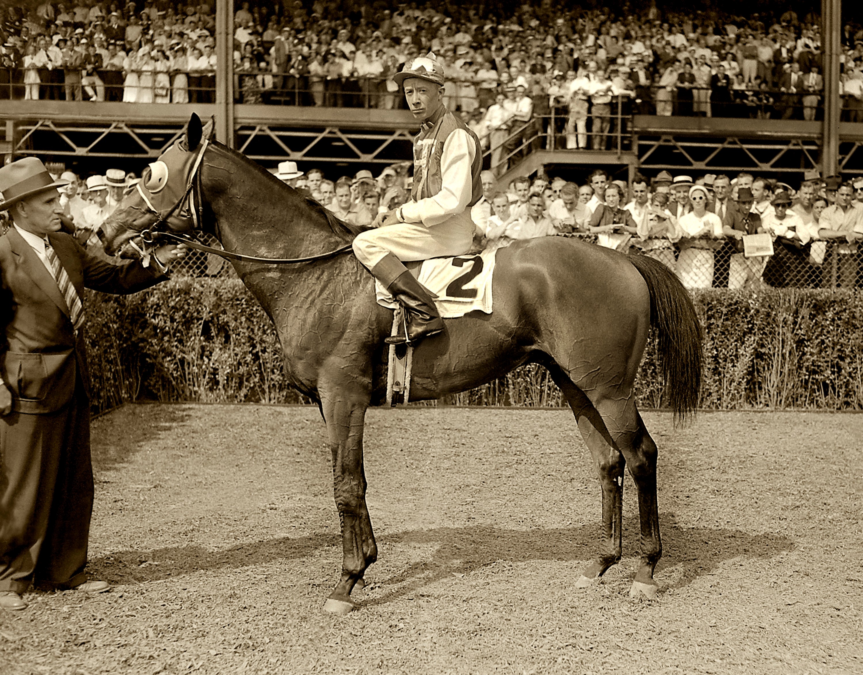 Seabiscuit (Red Pollard up) in the winner's circle with trainer Tom Smith for the 1937 Yonkers Handicap at Empire City (Keeneland Library Morgan Collection/Museum Collection)
