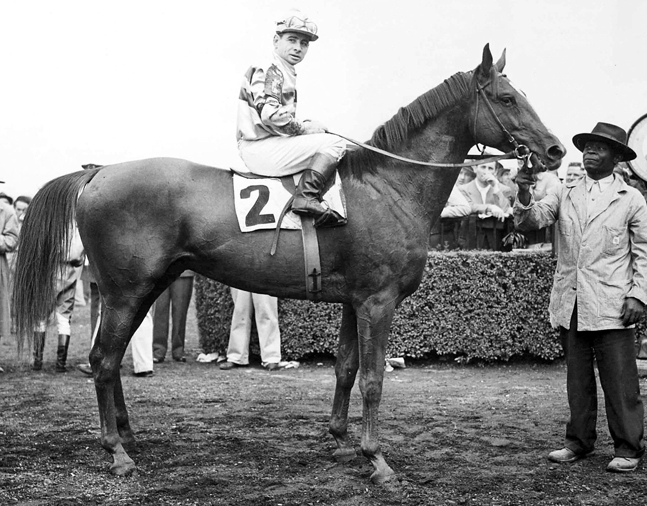Stymie (Johnny Longden up) in the winner's circle after winning the 1945 Saratoga Cup at Belmont Park  (Bert Morgan/Museum Collection)