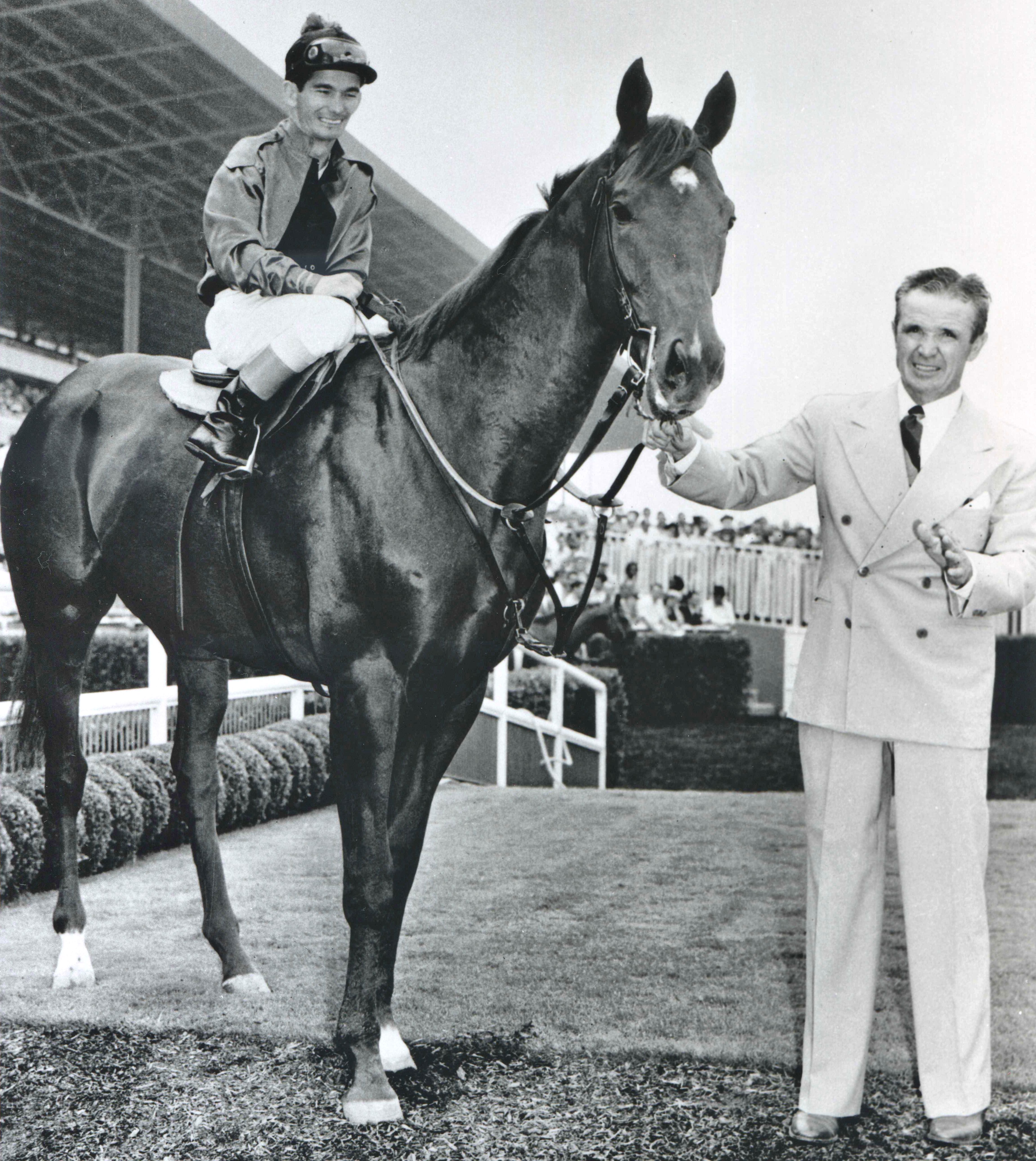 Swaps (Bill Shoemaker up) with trainer Mesh Tenney at Hollywood Park in 1955 (Bill Mochon/Museum Collection)
