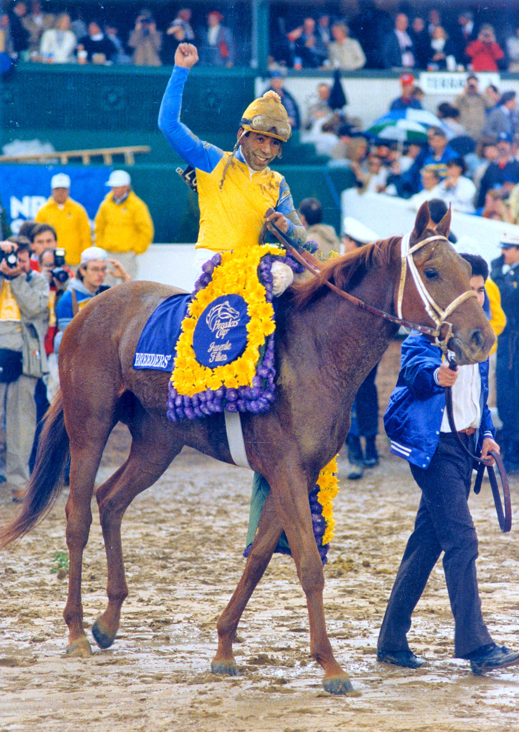 Angel Cordero, Jr. celebrates winning the 1988 Breeders' Cup Juvenile Fillies with Open Mind (The BloodHorse)