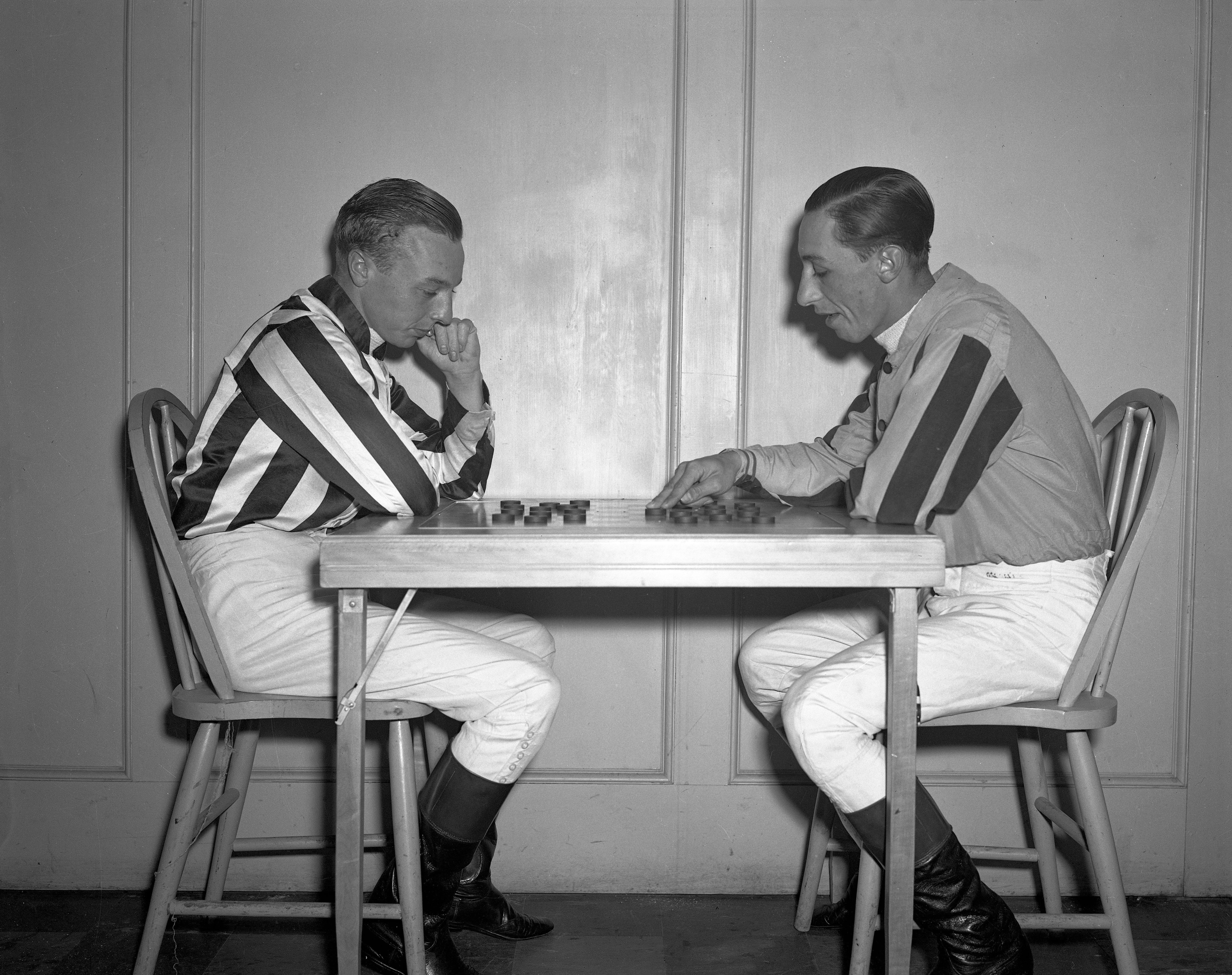 Wayne Wright, left, playing checkers with Eddie Arcaro (Keeneland Library Cook Collection)