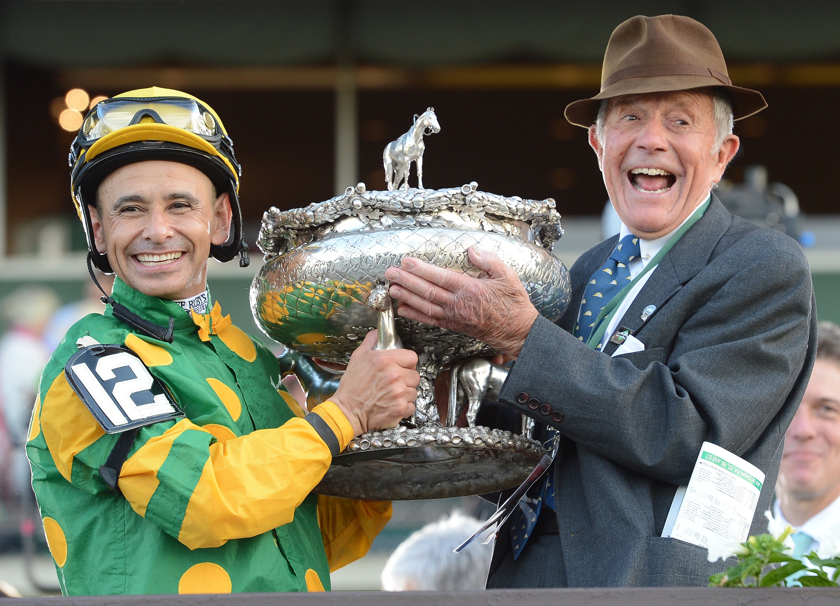 Mike Smith and Cot Campbell raise the Belmont Stakes Trophy in celebration of Palace Malice's 2013 Belmont Stakes victory (NYRA)