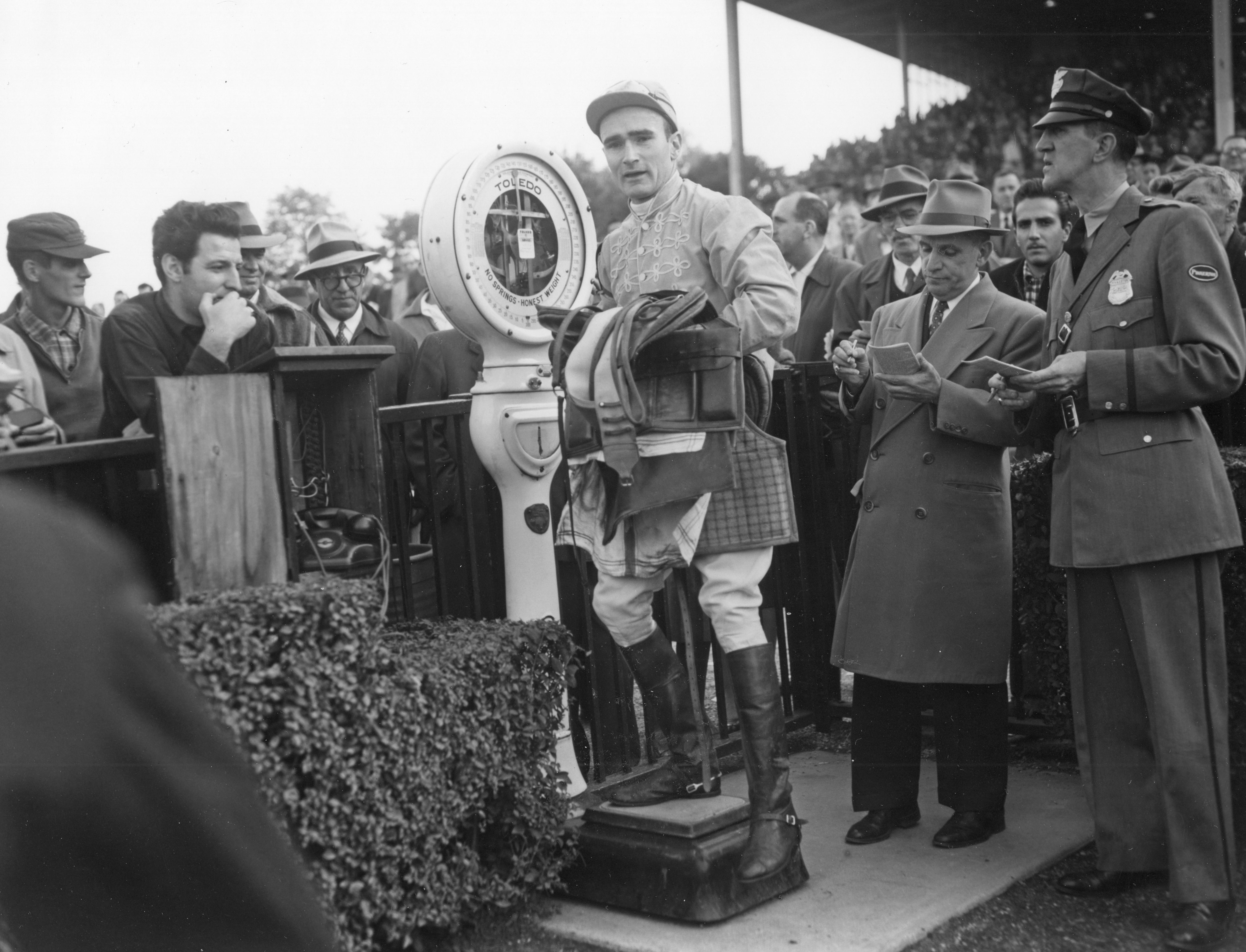 Frank Dooley Adams weighing in after a race at Belmont Park, October 1955 (Keeneland Library Morgan Collection/Museum Collection)