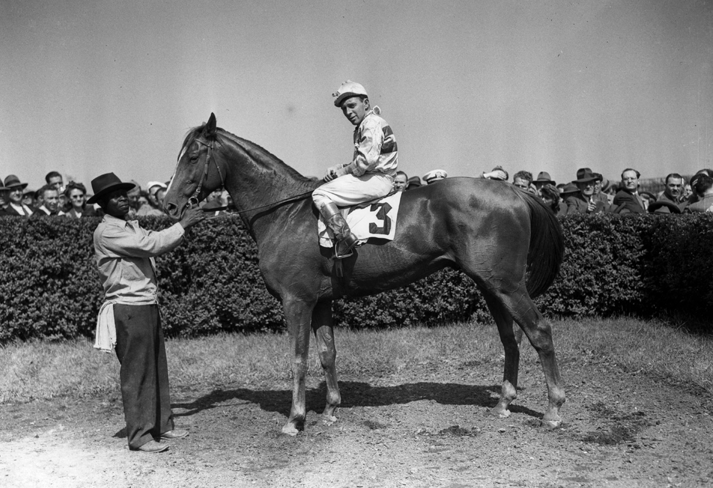 Stymie (John Adams up) in the winner's circle for a handicap event at Jamaica, May 1945 (Keeneland Library Morgan Collection/Museum Collection)