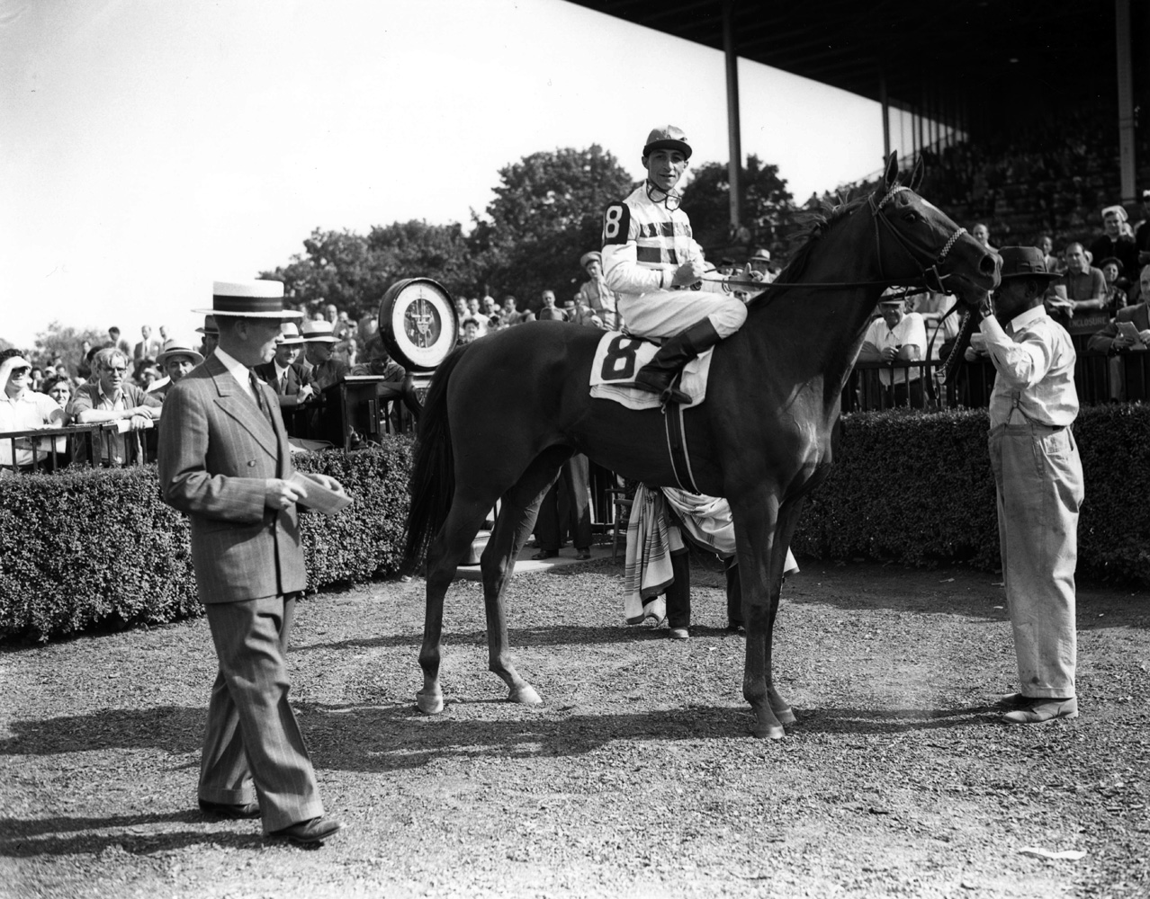 Eddie Arcaro and Busher in the winner's circle for the 1944 Adirondack at Belmont Park (Keeneland Library Morgan Collection/Museum Collection)