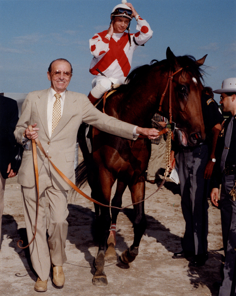 Pat Day and Danzig Connection being led into the winner's circle by trainer Woody Stephens (Bob Coglianese/Museum Collection)