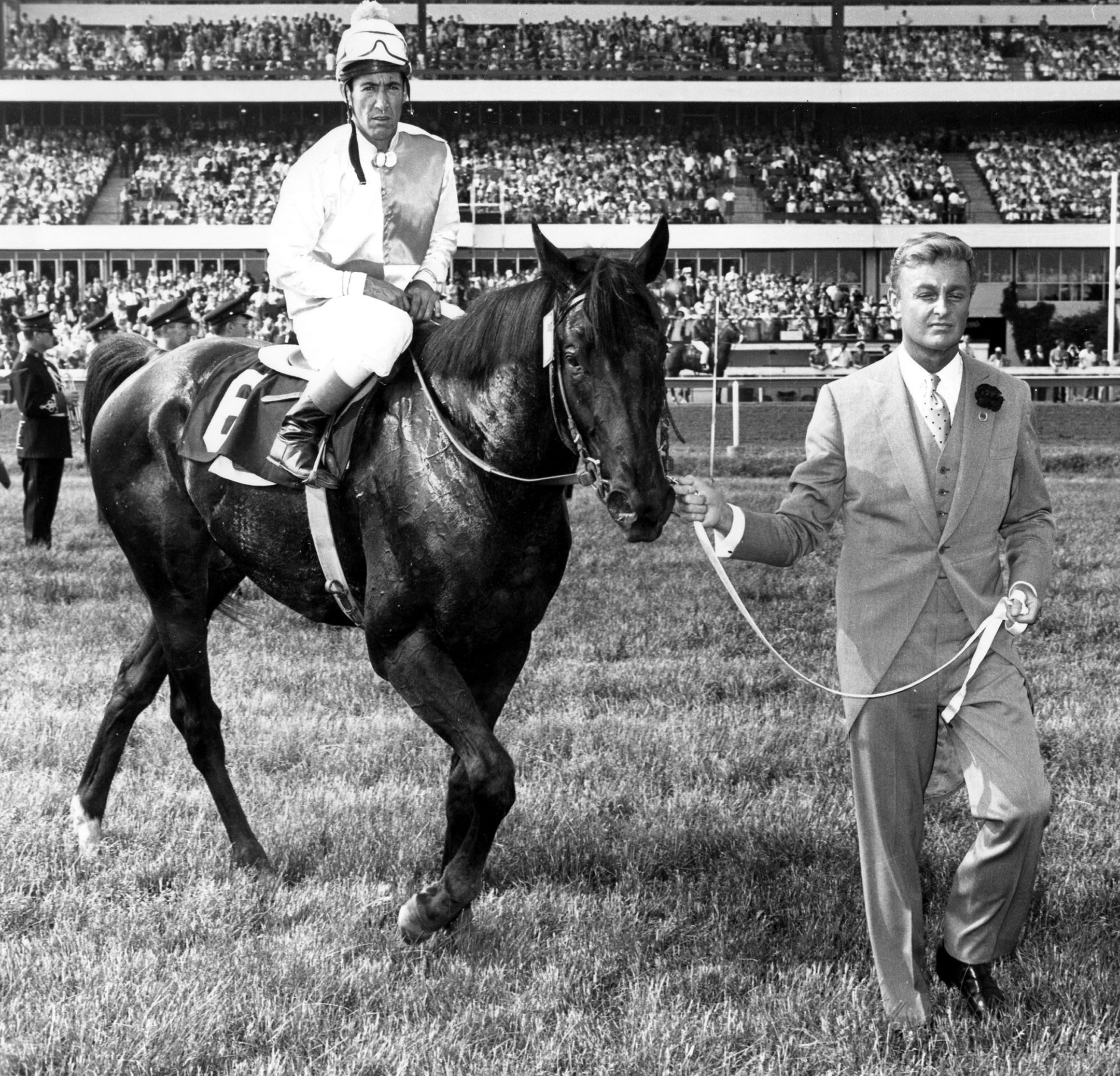 Avelino Gomez and Titled Hero enter the winner's circle after winning the 1966 Queen's Plate at Woodbine (Michael Burns/Museum Collection)