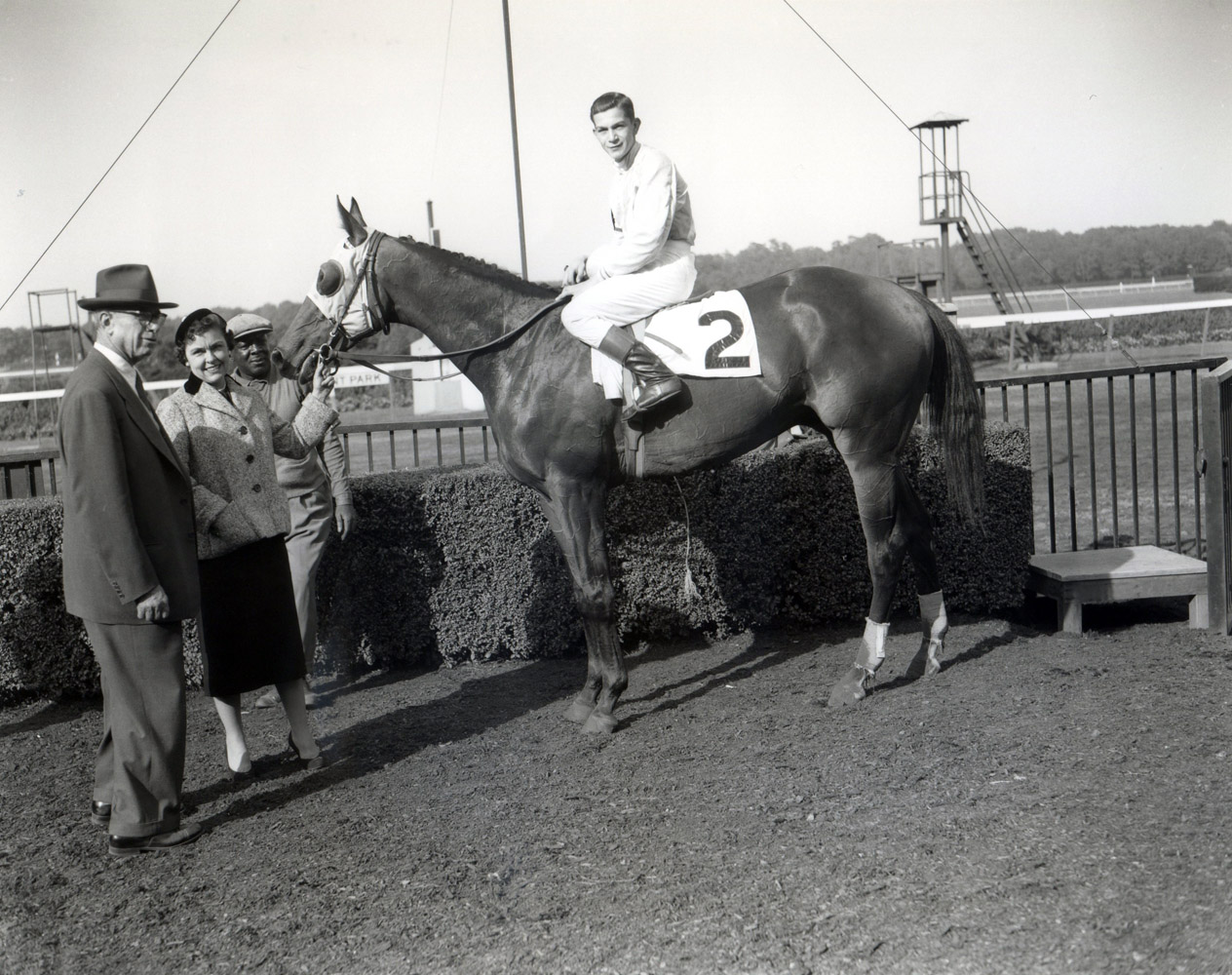 Bill Hartack and Dedicate in the winner's circle after winning the 1957 Woodward at Belmont Park (Keeneland Library Morgan Colleciton/Museum Collection)