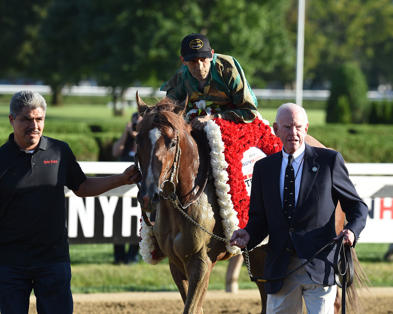John Velazquez and Code of Honor being led in by William S. Farish III after winning the 2019 Travers Stakes (NYRA)