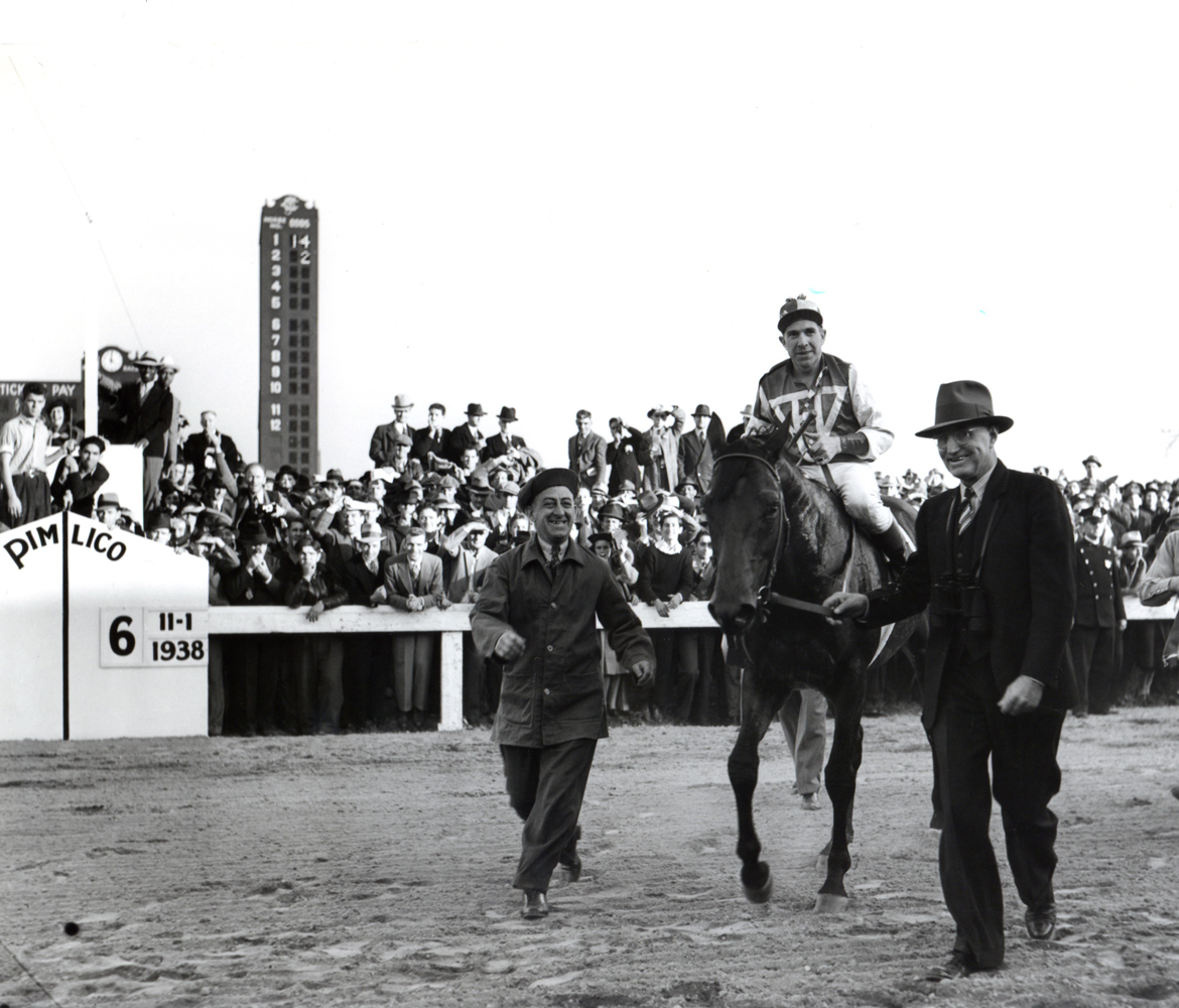 George Woolf and Seabiscuit being led in by trainer Tom Smith after defeating Triple Crown winner War Admiral in the 1938 Pimlico Special match race (Keeneland Library Morgan Collection/Museum Collection)