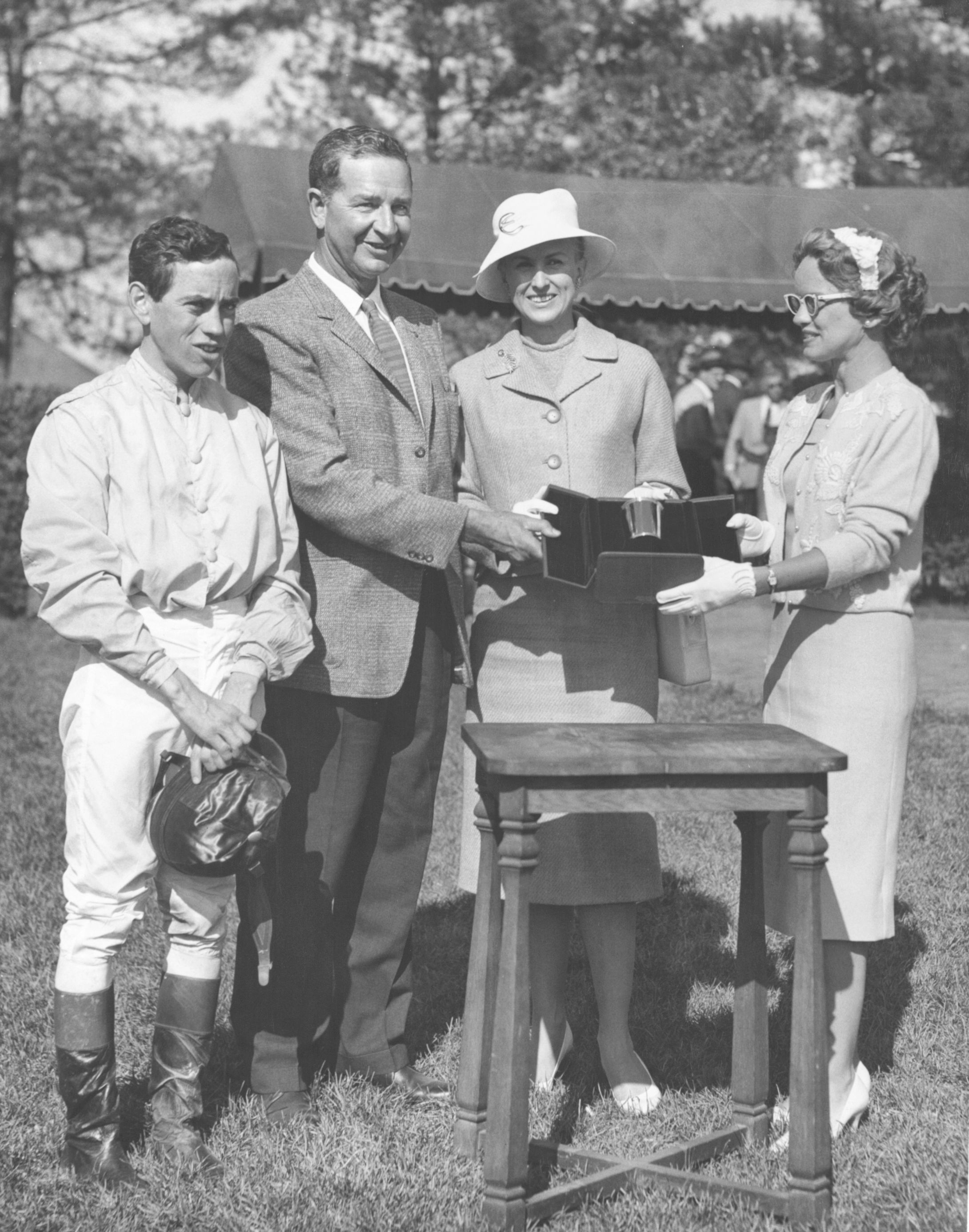 From left, John Rotz, C. V. Whitney, Marylou Whitney, and Mrs. Len Shouse III at Keeneland, 1960 Lafayette Stakes trophy presentation (Keeneland Library)