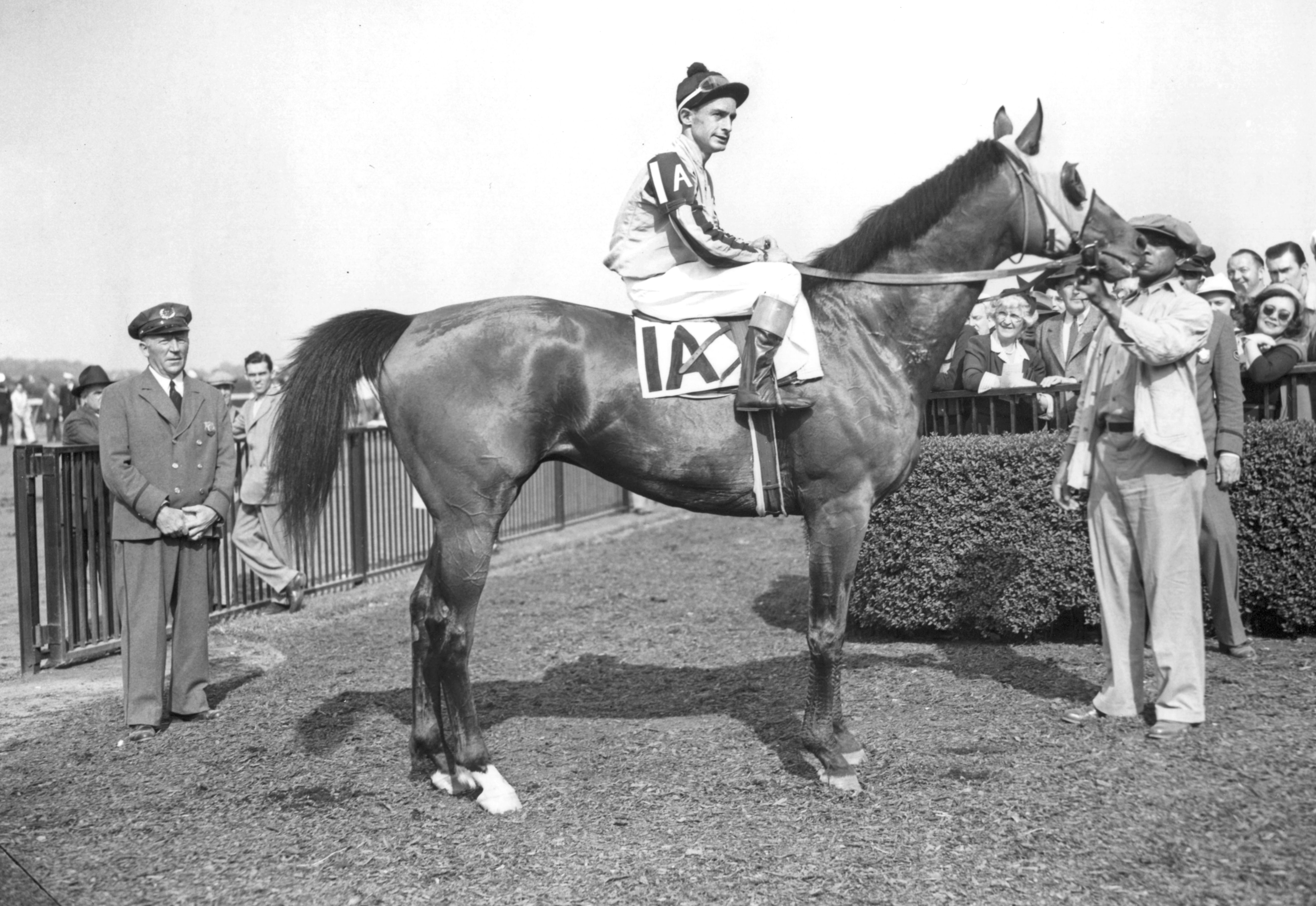 Ted Atkinson and Devil Diver in the winner's circle for the 1944 Metropolitan Handicap at Belmont Park (Keeneland Library Morgan Collection/Museum Collection)