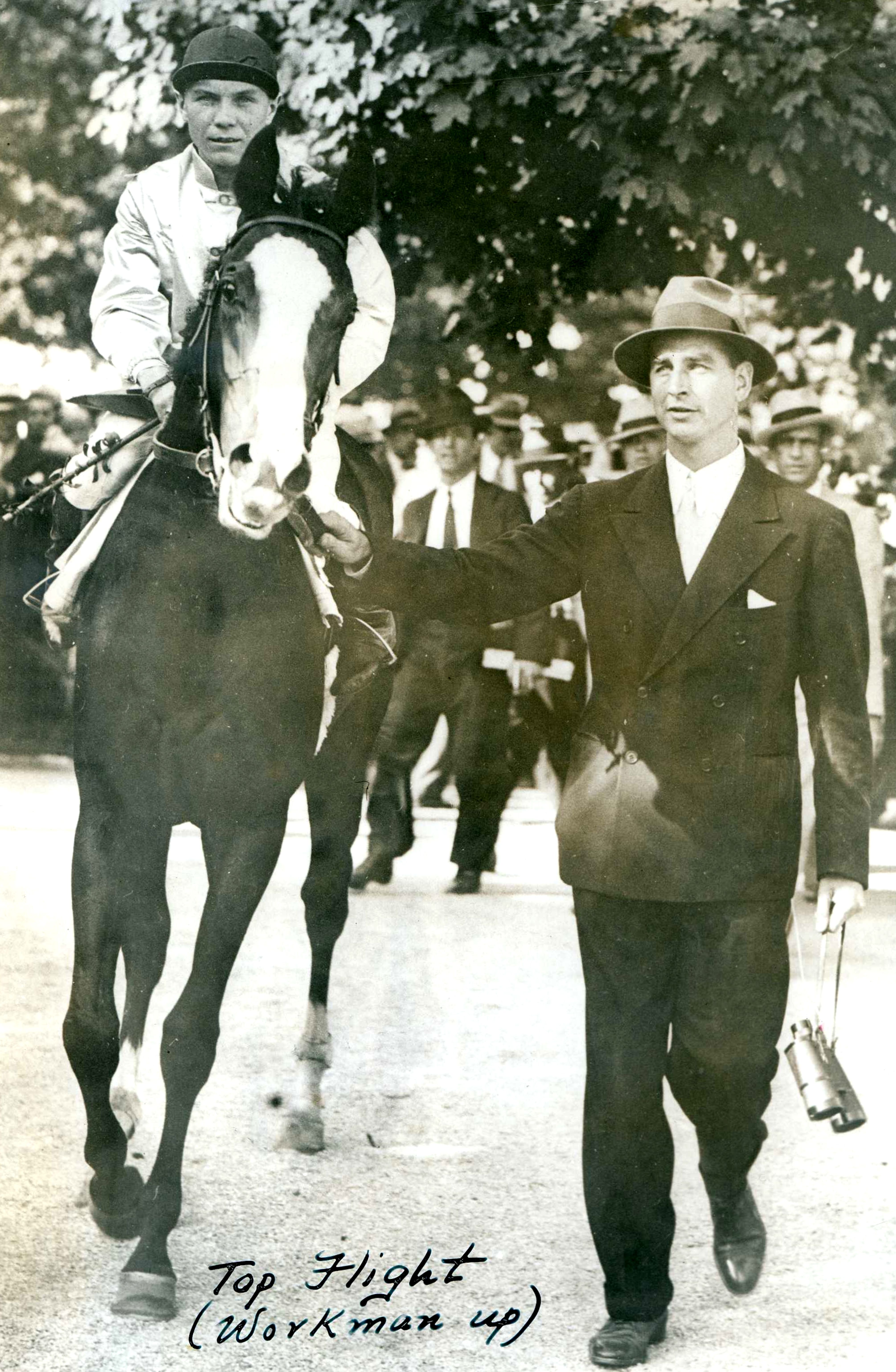 C. V. Whitney leads Top Flight (Raymond Workman up) out of the paddock (Museum Collection)
