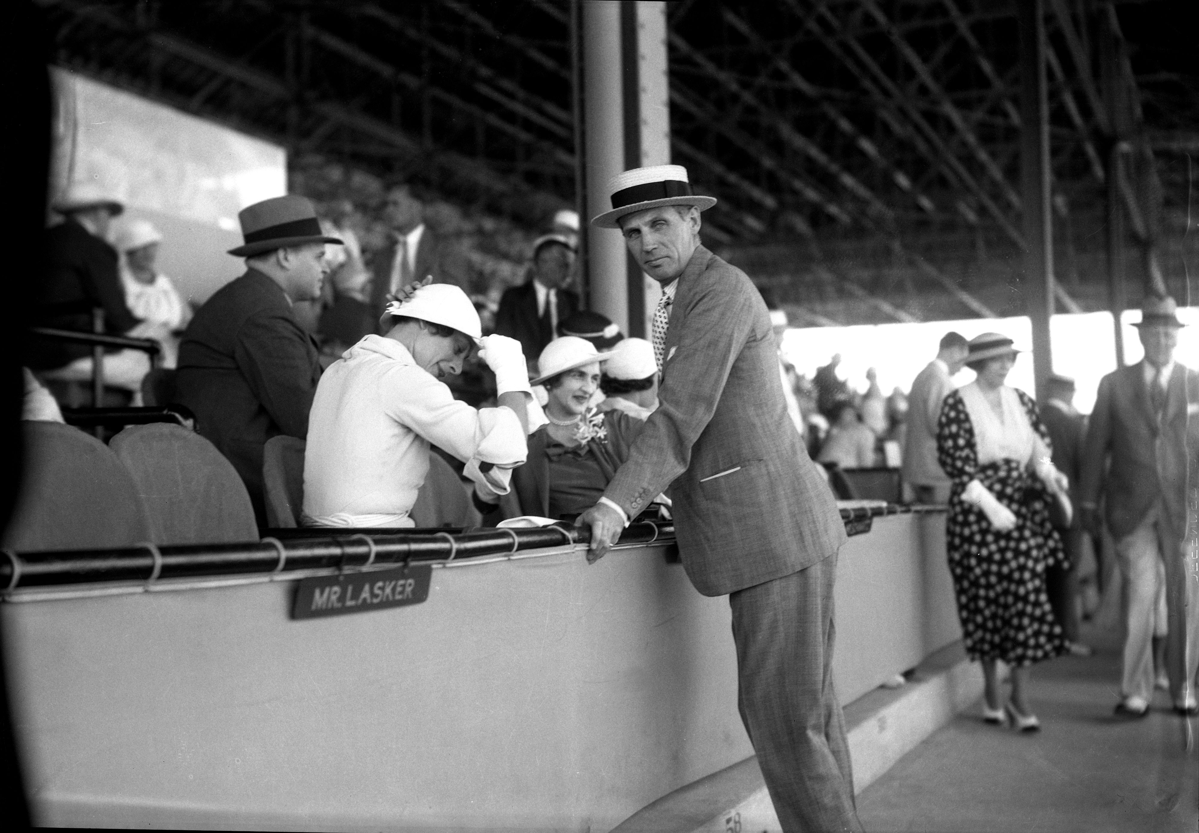 George D. Widener, Jr. visits with Mrs. Isabel Cleves Dodge Sloane in the stands (Keeneland Library Cook Collection)