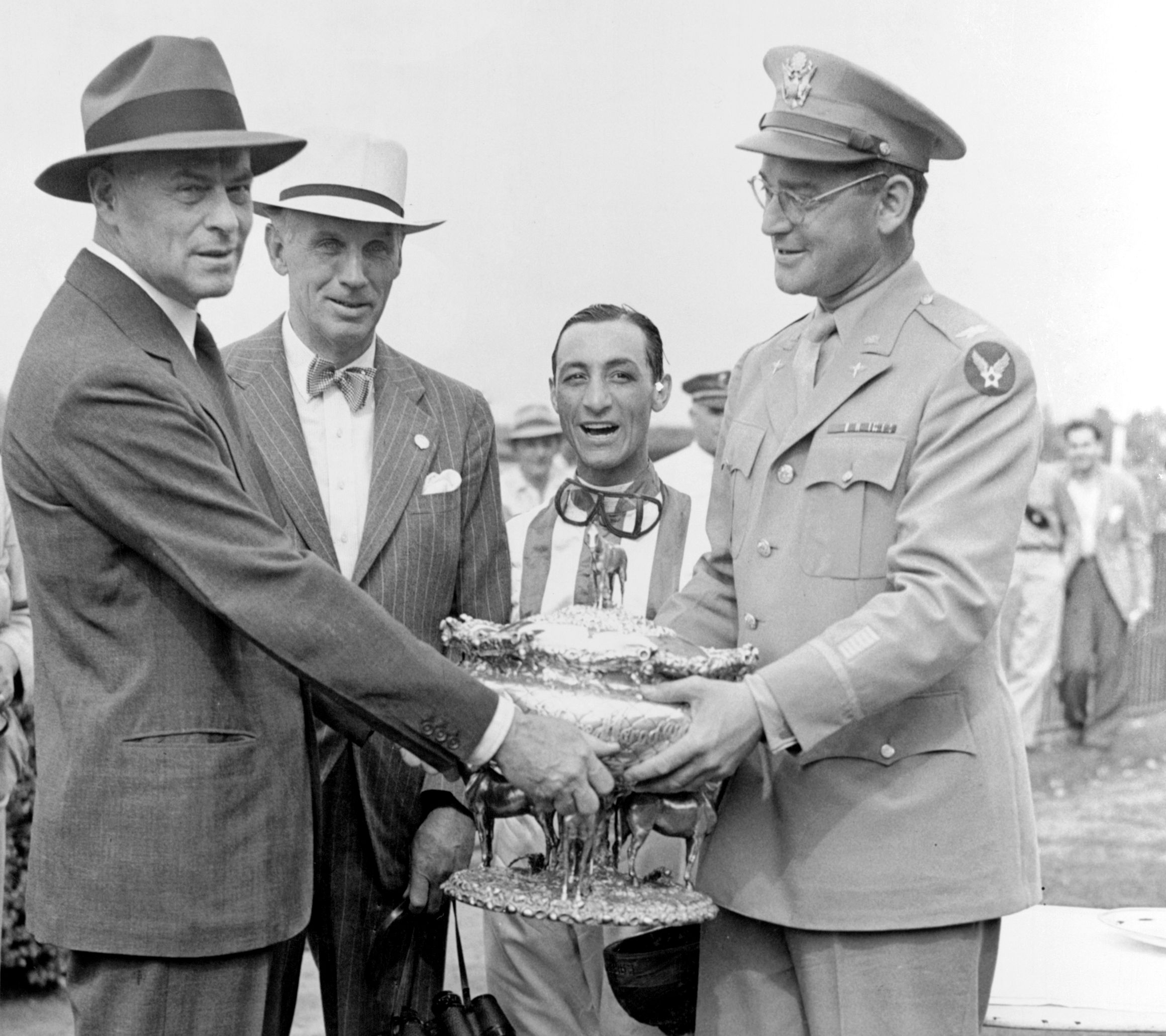 From left, Walter Jeffords, George D. Widener, Jr., Eddie Arcaro, and John Hay Whitney, 1942 Belmont Stakes (Keeneland Library Morgan Collection)