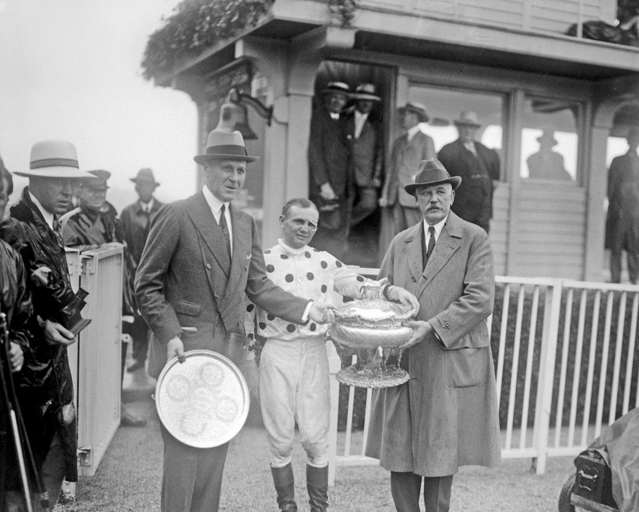 Jockey Earl Sande and owner William Woodward, Sr. receive the Belmont Stakes trophies from Joseph E. Widener after Gallant Fox's victory in 1930 (Keeneland Library Cook Collection)