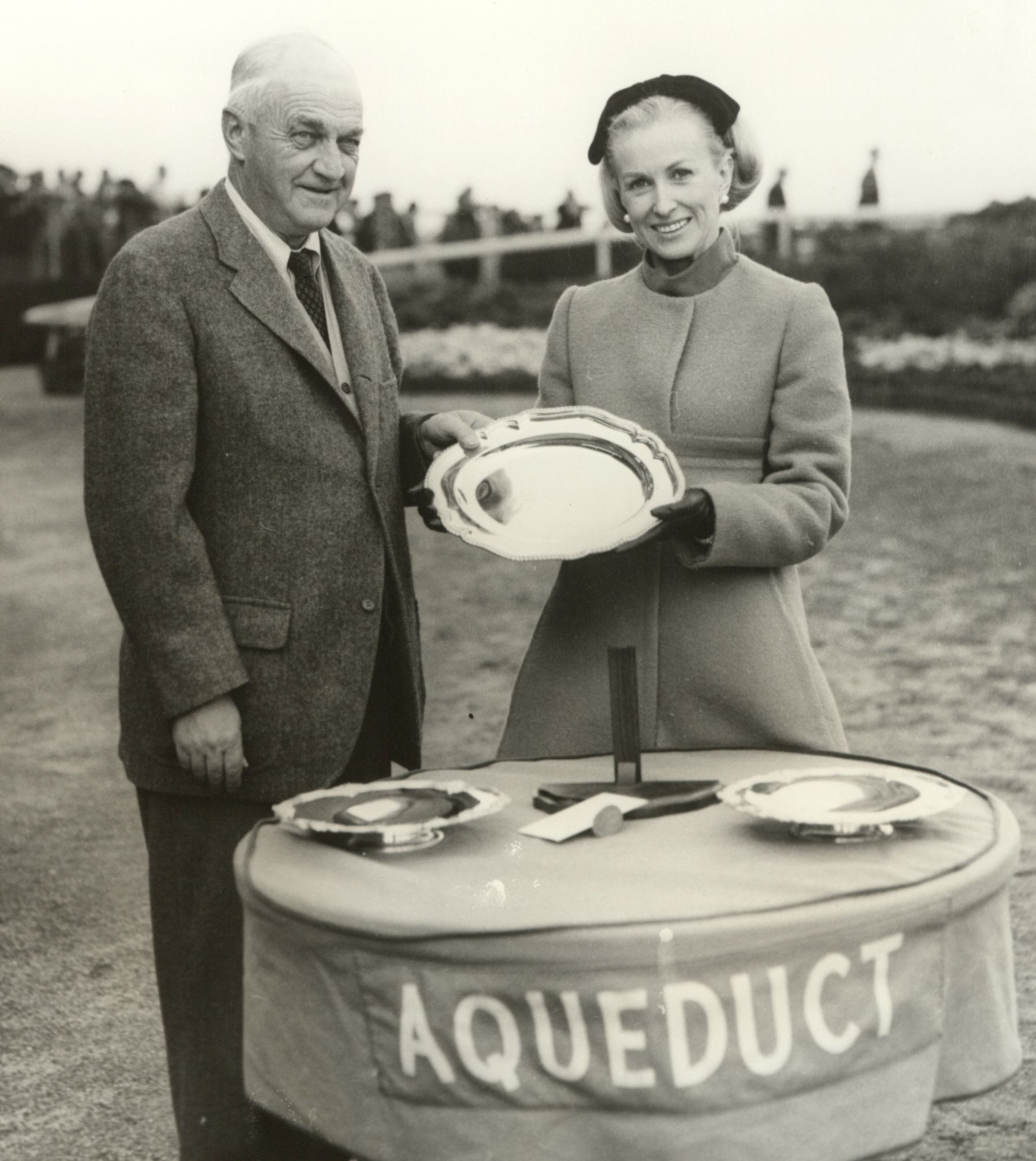 Marylou Whitney and John M. Gaver at Aqueduct, 1967 (Keeneland Library Thoroughbred Times Collection)