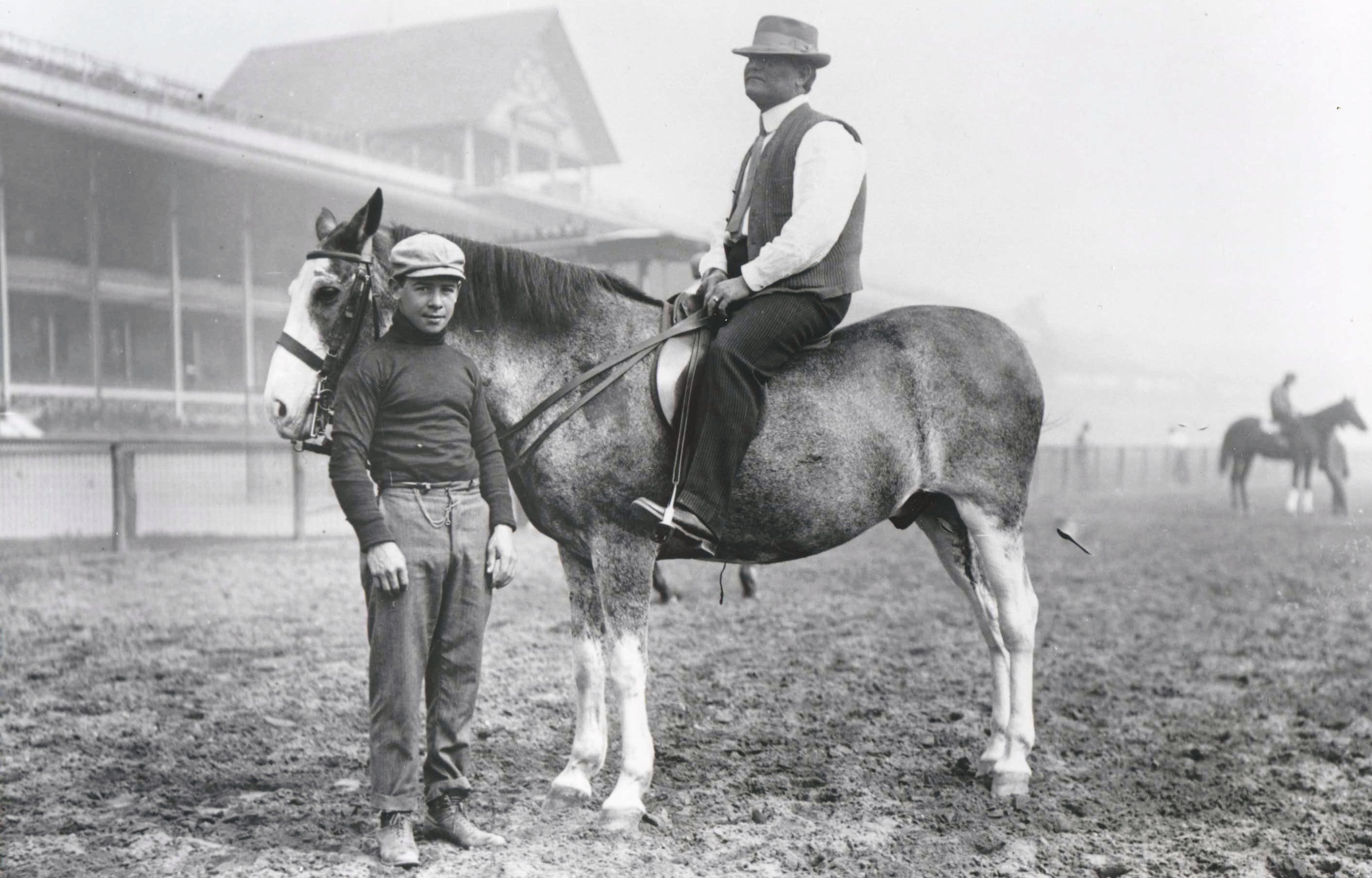 Jockey Joe Notter stands by trainer James G. Rowe, Sr. on horseback (Keeneland Library Cook Collection/Museum Collection)