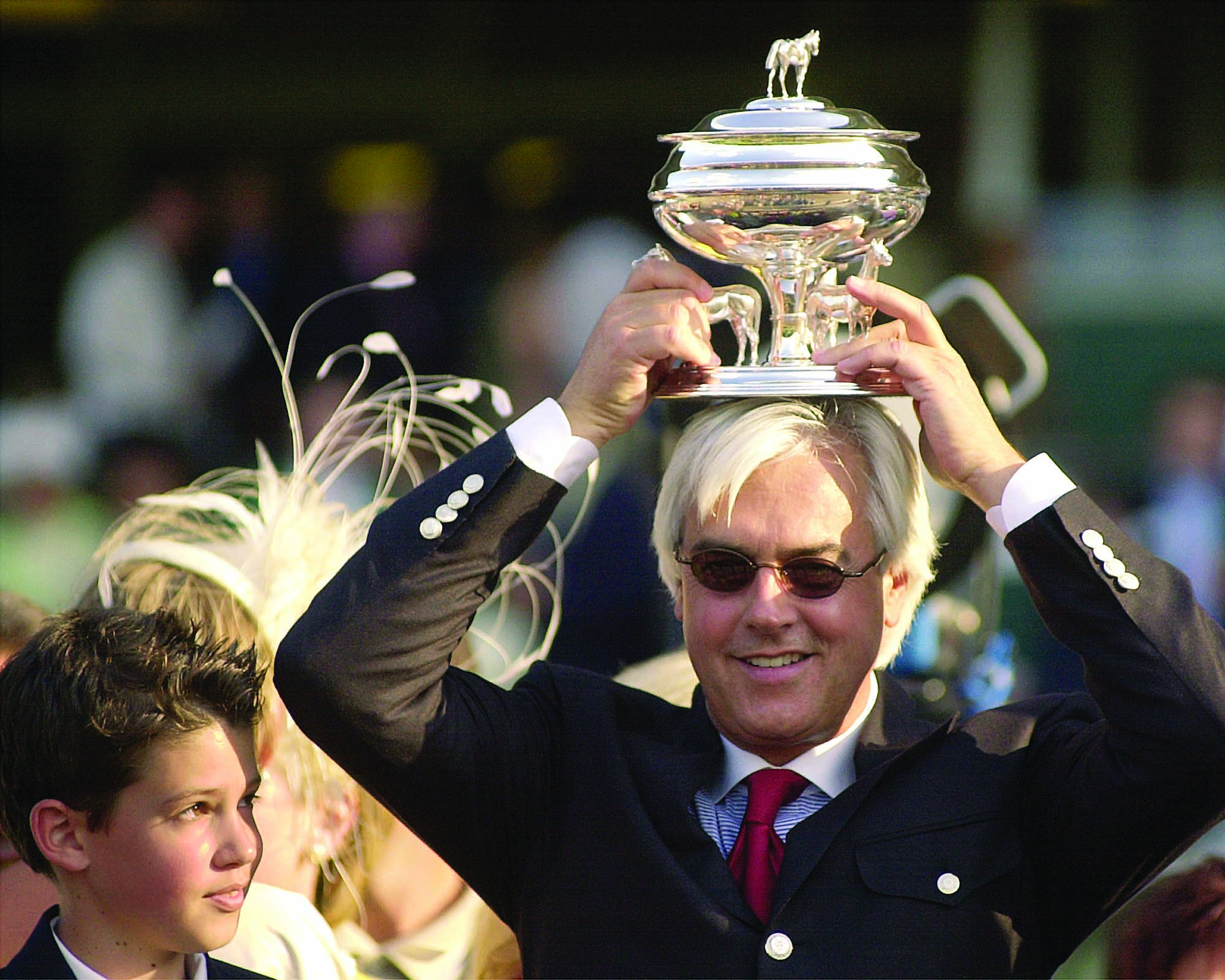 Bob Baffert puts the Belmont Stakes winning trainer trophy on his head after Point Given's 12 1/4 length victory in the 133rd running of The Belmont Stakes at Belmont Park (Garry Jones)