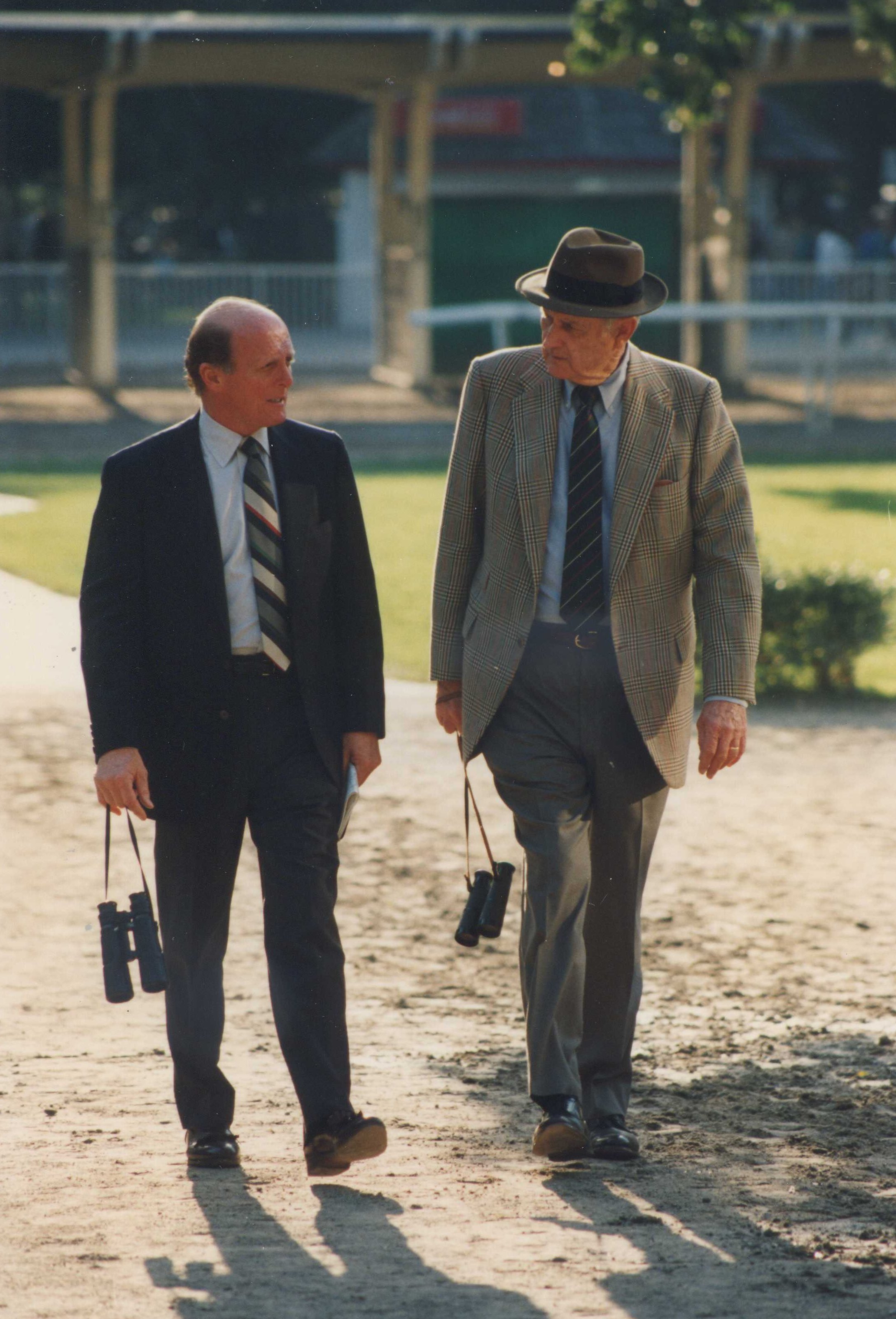 Hall of Fame trainers LeRoy Jolley and MacKenzie Miller walking in the Belmont Park paddock in 1992 (Barbara D. Livingston/Museum Collection)