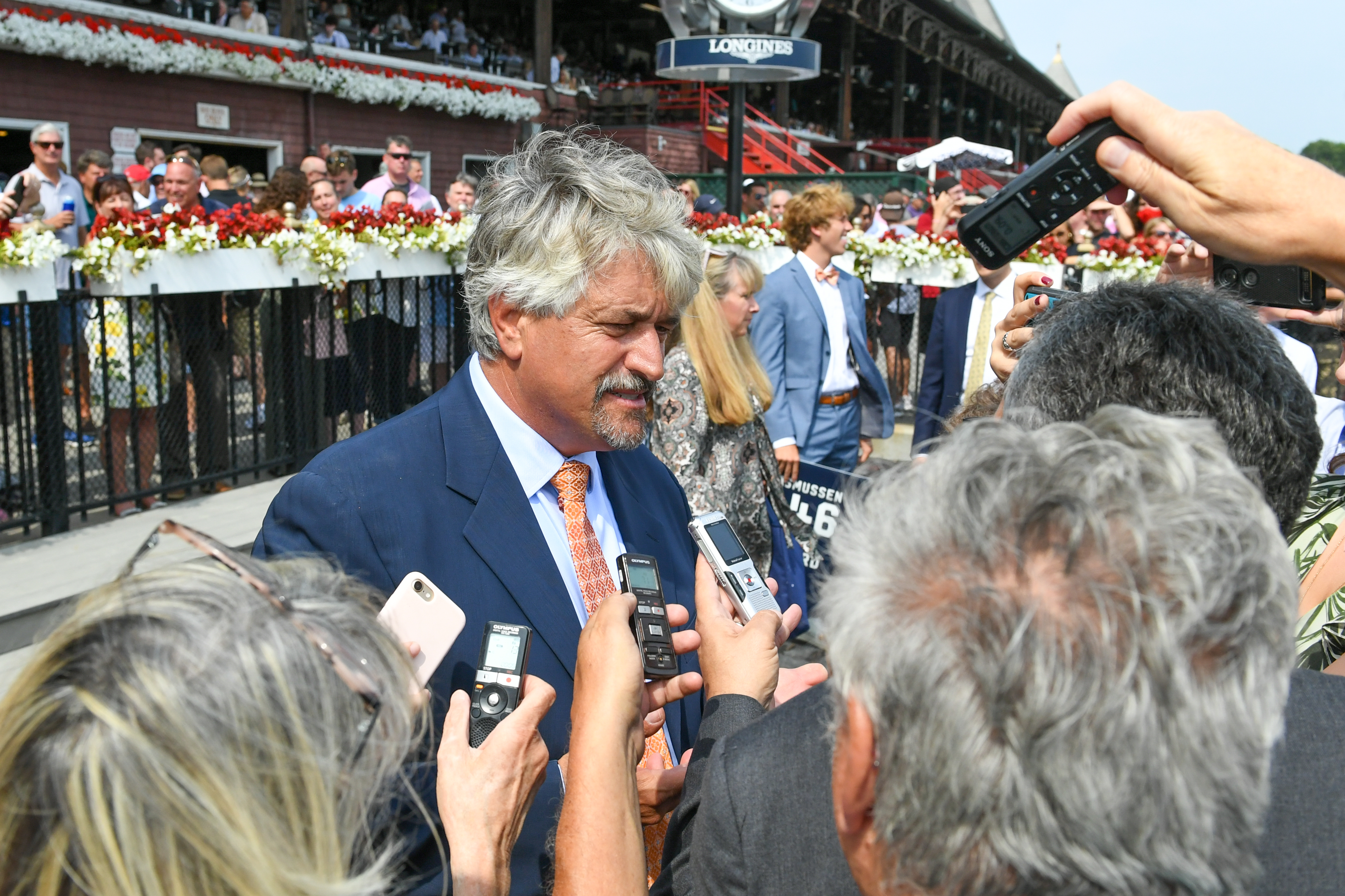 Steve Asmussen is interviewed after career win 9,446, setting a new North American record, at Saratoga Race Course, Aug. 7, 2021 (Bob Mayberger/Museum Collection)
