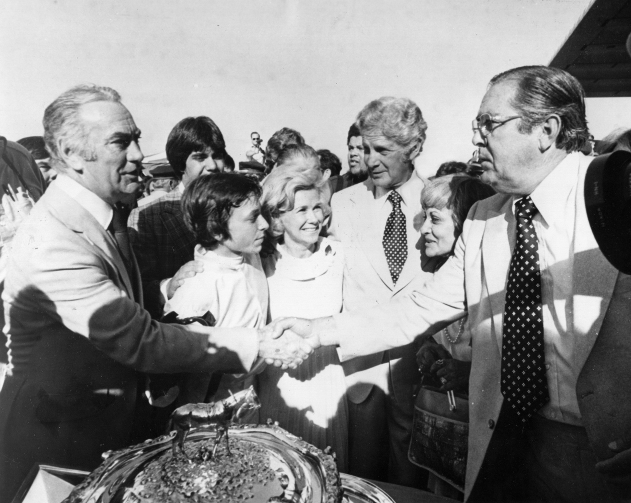 New York Governor Carey congratulates the winning connections of Affirmed after their horse wins the 1978 Belmont Stakes and Triple Crown (NYRA/Museum Collection)