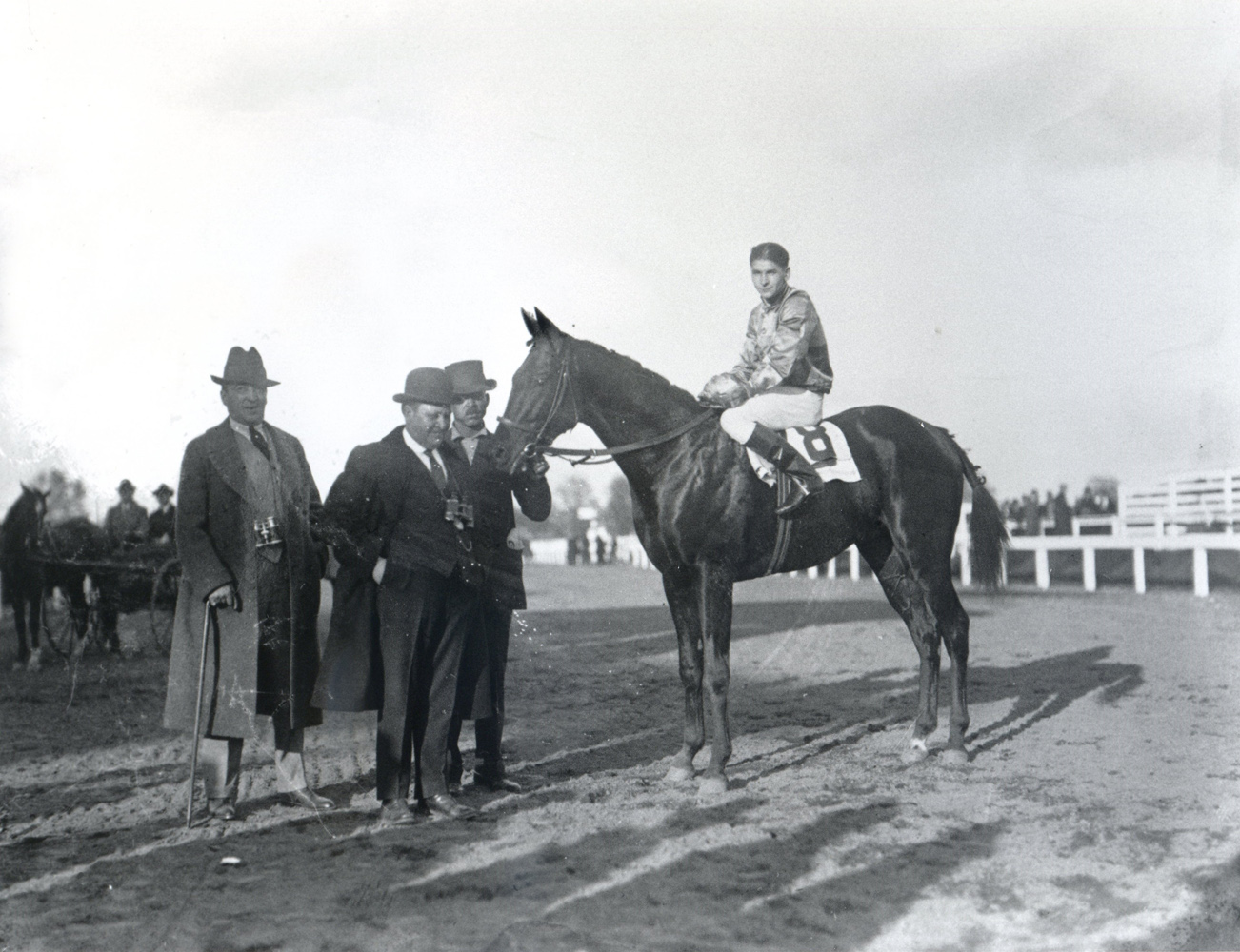 Fred Burlew with Morvich (Albert Johnson up) in the winner's circle for the 1921 Pimlico Futurity (Keeneland Library Cook Collection)