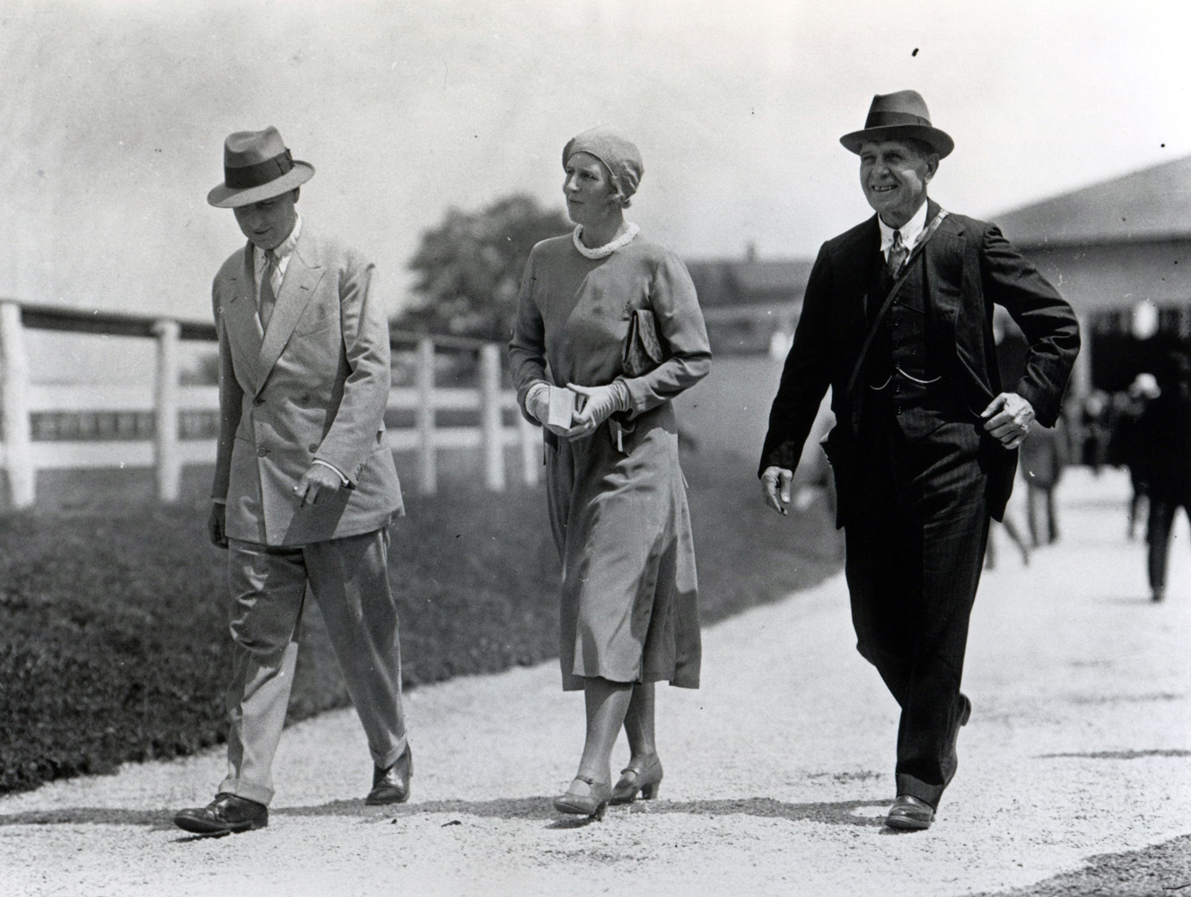 Thomas Hitchcock (on right) walking with an unidentified couple on a farm (Keeneland Library Cook Collection/Museum Collection)