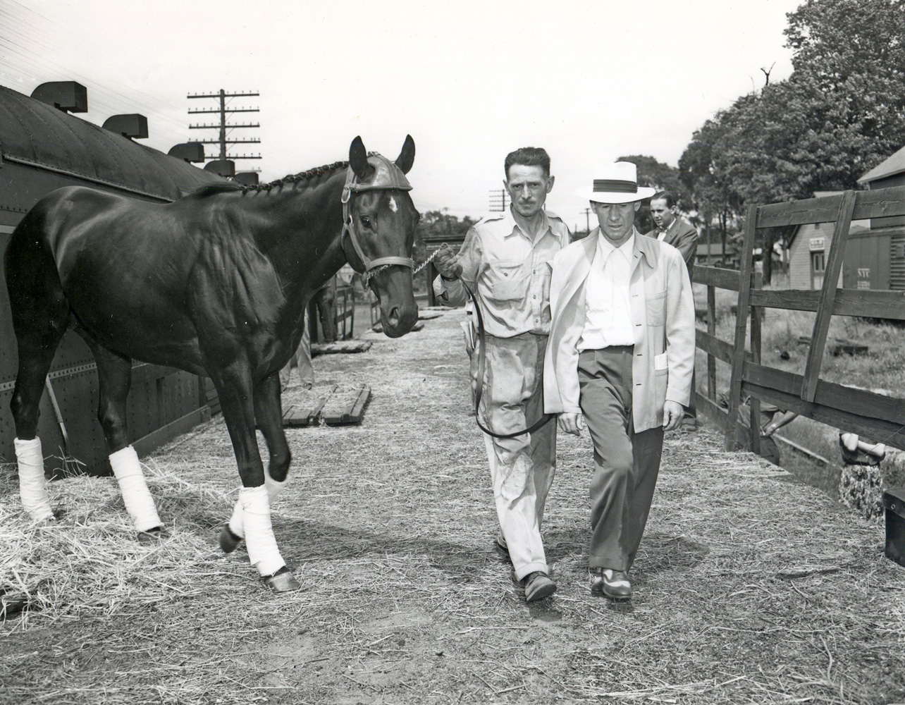 Noor arriving by train at Saratoga with trainer Burley Parke, August 1950 (Keeneland Library Morgan Collection/Museum Collection)