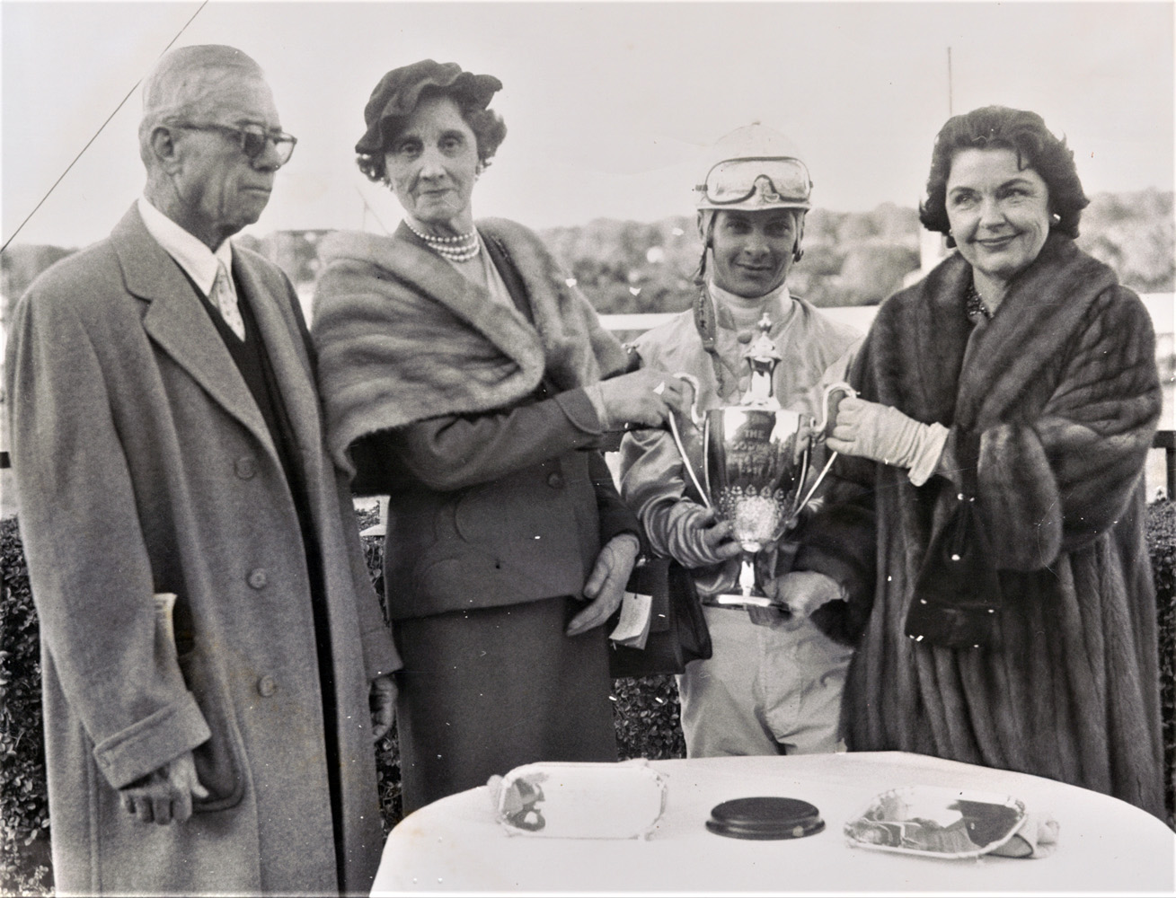 G. Carey Winfrey, Mrs. William Woodward, Sr., Bill Hartack, and Mrs. Jan Burke at a trophy presentation (Keeneland Library Morgan Collection)
